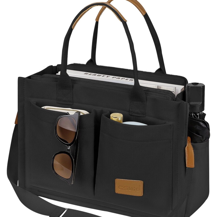 The Black Canvas Work Tote. Structured canvas holds its shape only while the weave stays dry enough to keep its tension.